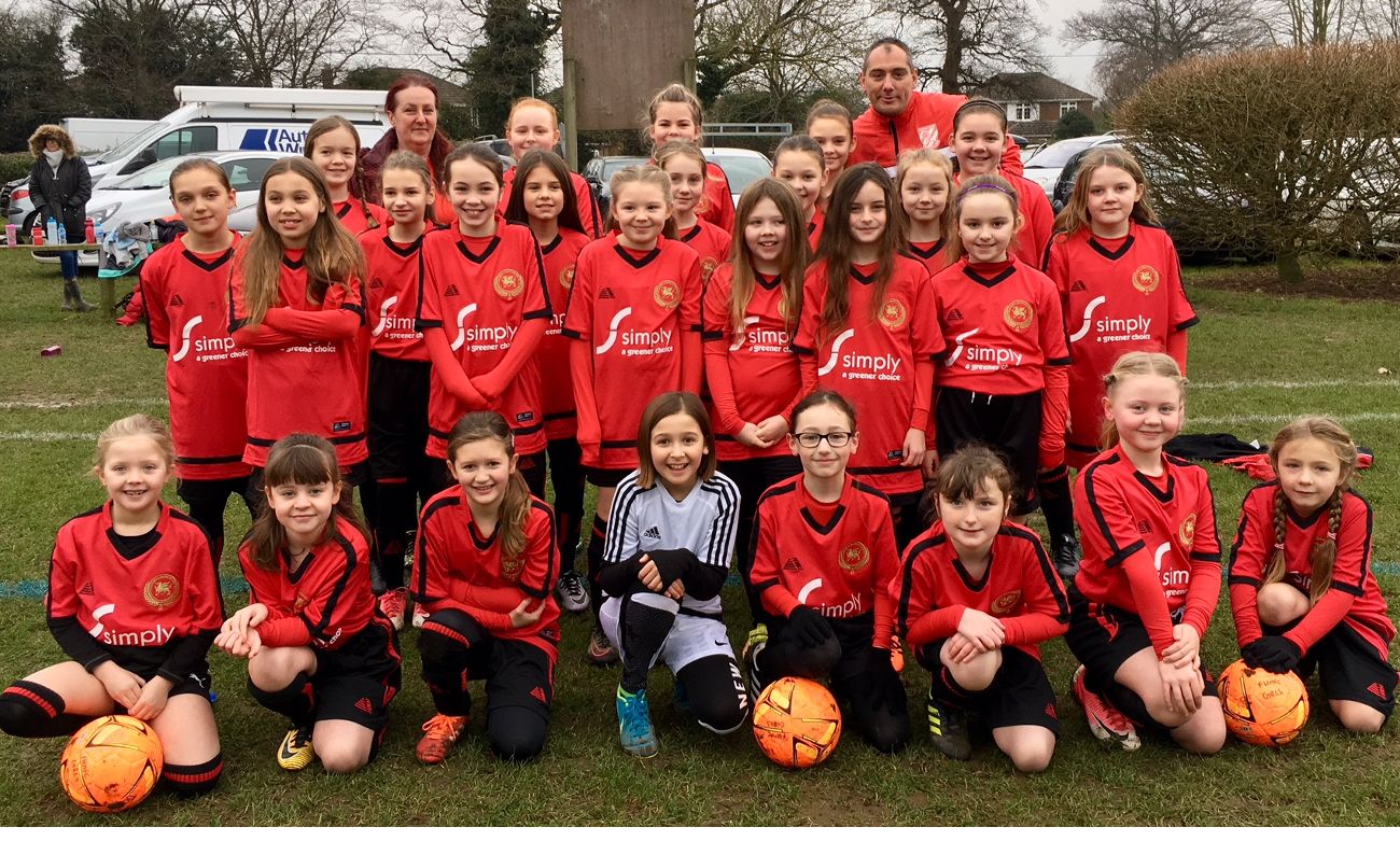 Flackwell Heath Minors Football Club (FHMFC) - girls team wearing Simply Waste Solutions sponsored t-shirts
