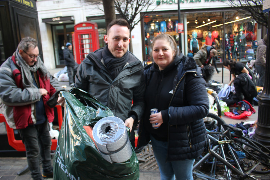 Simply Waste Solutions driver, Cledwyn and Street Angels UK helper carry mats and sleeping bags