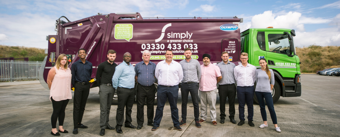 Simply Waste Solutions Stanwell depot team standing with CEO, James Capel, in front of trade waste truck for Dennis Eagle photoshoot