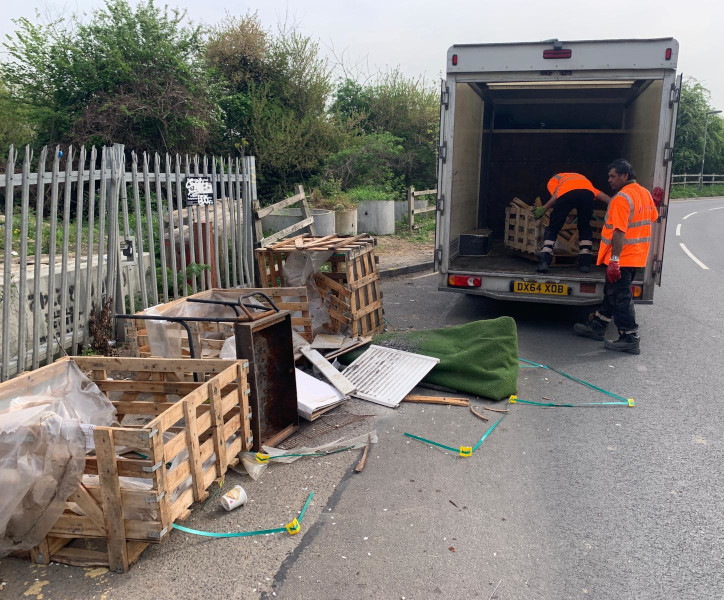 Simply Waste Solutions driver and loader clearing fly tipped waste