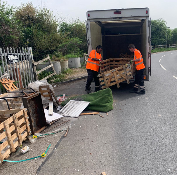 Simply Waste Solutions driver and loader clearing fly tipped waste
