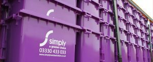 Large image of Simply Waste Solutions purple 1100 Litre wheelie bins on a truck, being delivered to the Stanwell depot