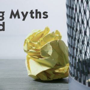 Debunking Recycling Myths. Paper next to waste bin