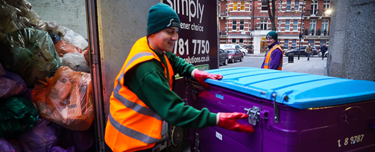 Simply Waste Solutions driver emptying 1100 litre wheelie bin