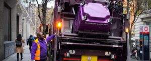 Simply Waste Solutions driver tipping wheelie bin into trade waste truck