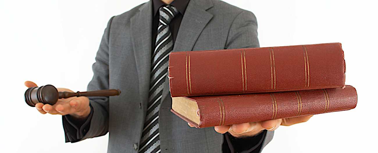 judge holding books and gavel