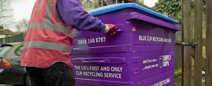 Simply Waste Solutions driver pulling 1100 litre cup recycling wheelie bin