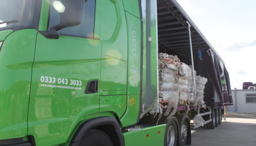 Simply Waste Solutions artic truck being loaded with baled waste